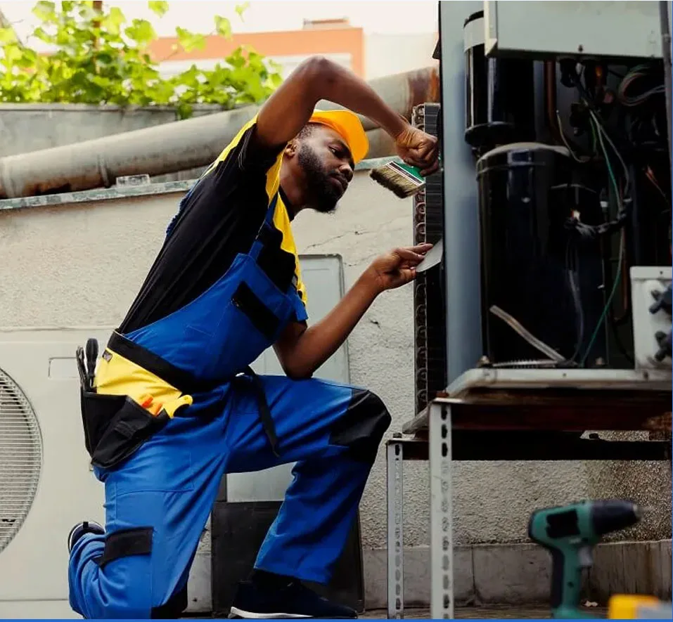 Berks HVAC technician repairing outdoor air conditioning unit for residential cooling system
