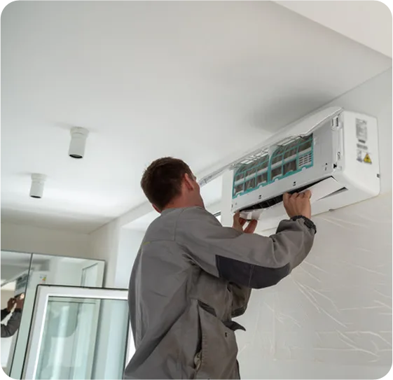 Berks HVAC Technician installing wall mounted air conditioning unit inside home