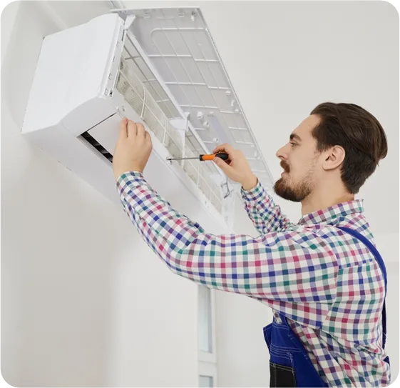 Berks HVAC technician servicing indoor air conditioner filter and cooling components
