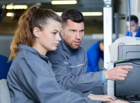 Berks customer service team coordinating HVAC and plumbing service calls in the office.