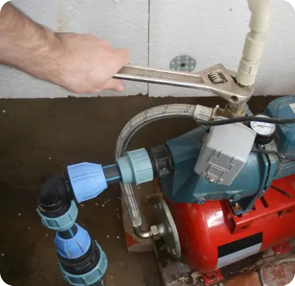 Well pump pressure system adjustment and plumbing repair in basement